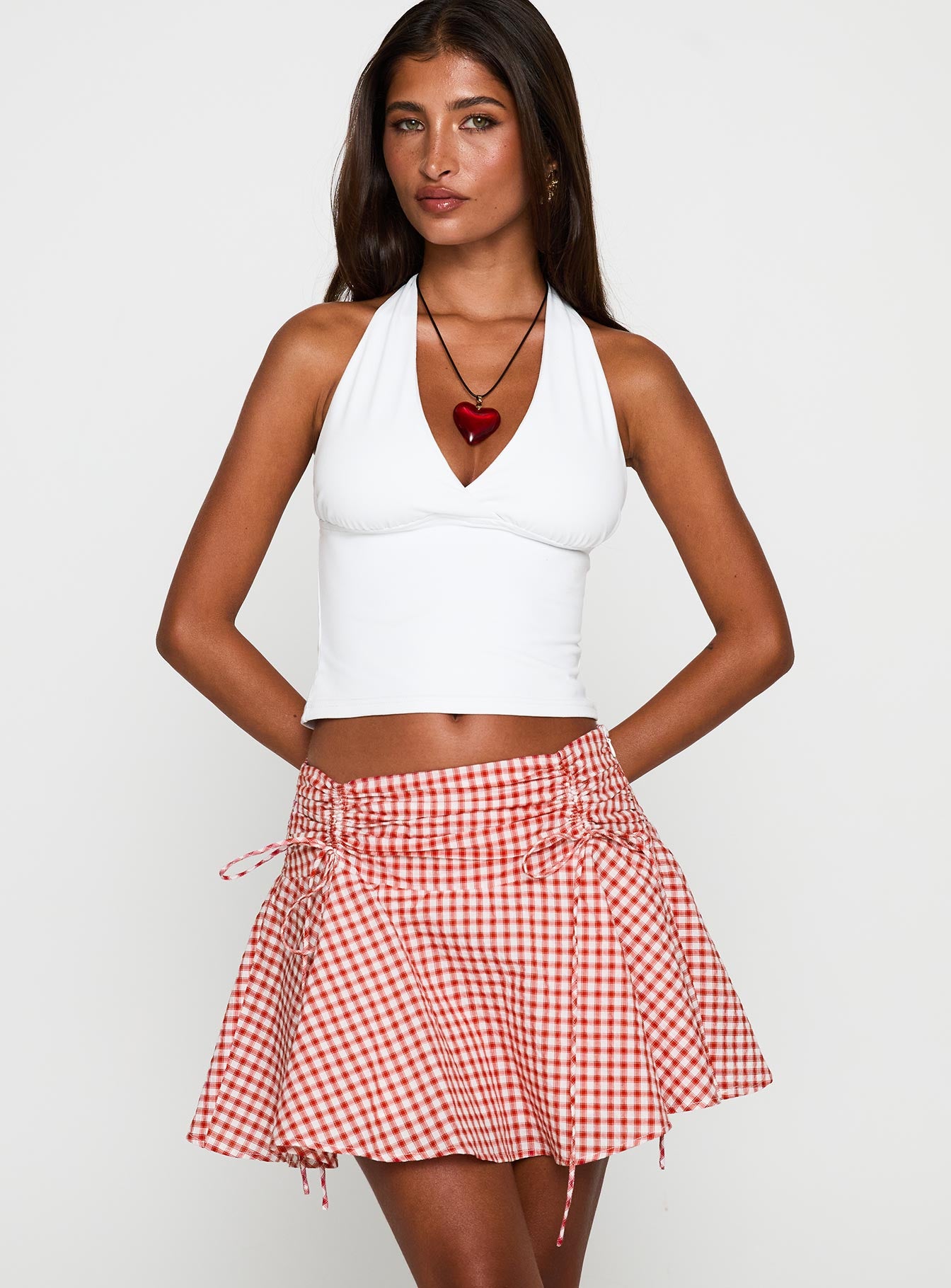   front view of model wearing Princess Polly Sweet Verona Ruched Mini Skirt Red Check Mini Skirts 