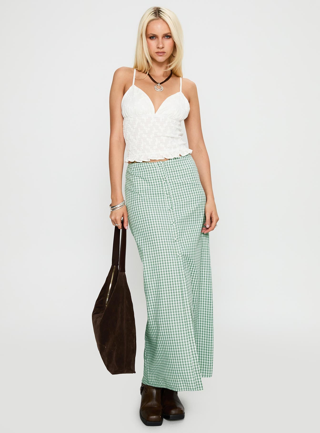   side view of model wearing Princess Polly Macadamia Maxi Skirt Green / White Maxi 