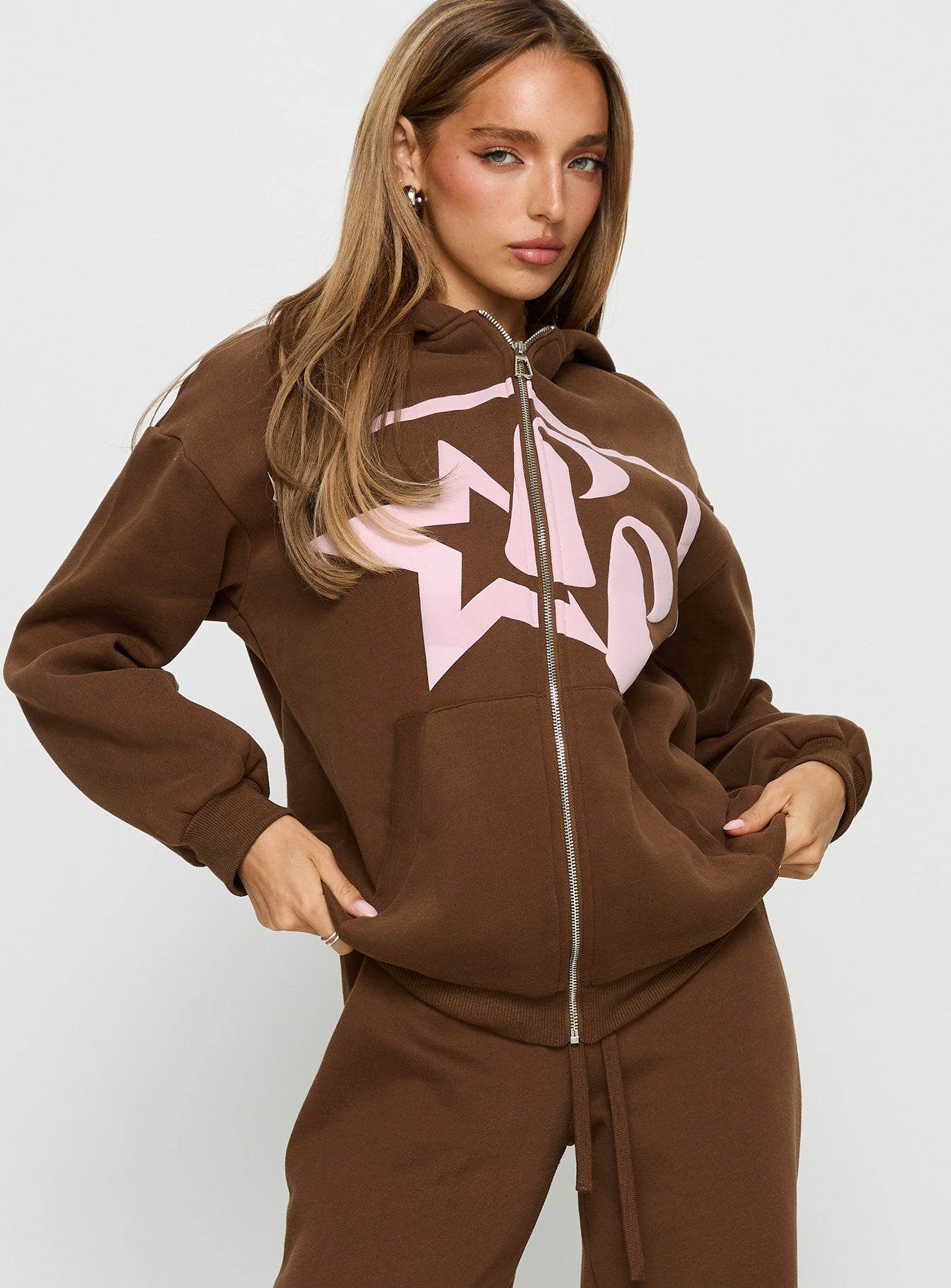 front view of model wearing Princess Polly Princess Polly Stargirl Zip Through Jumper Brown Longline Jumpers 