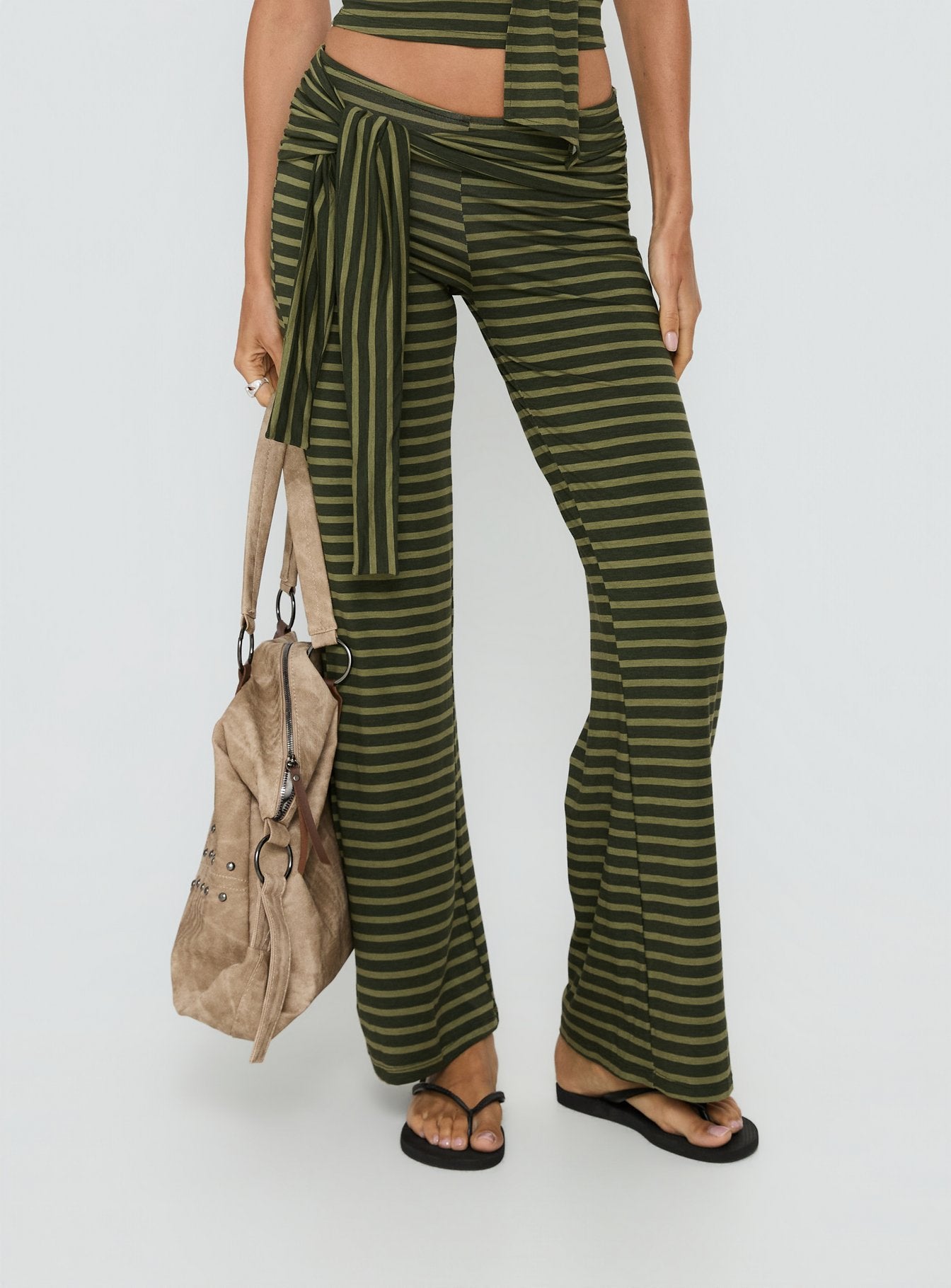 back view of model wearing Princess Polly Esata Tie Detail Pants Green Stripe Mid Rise Pants 