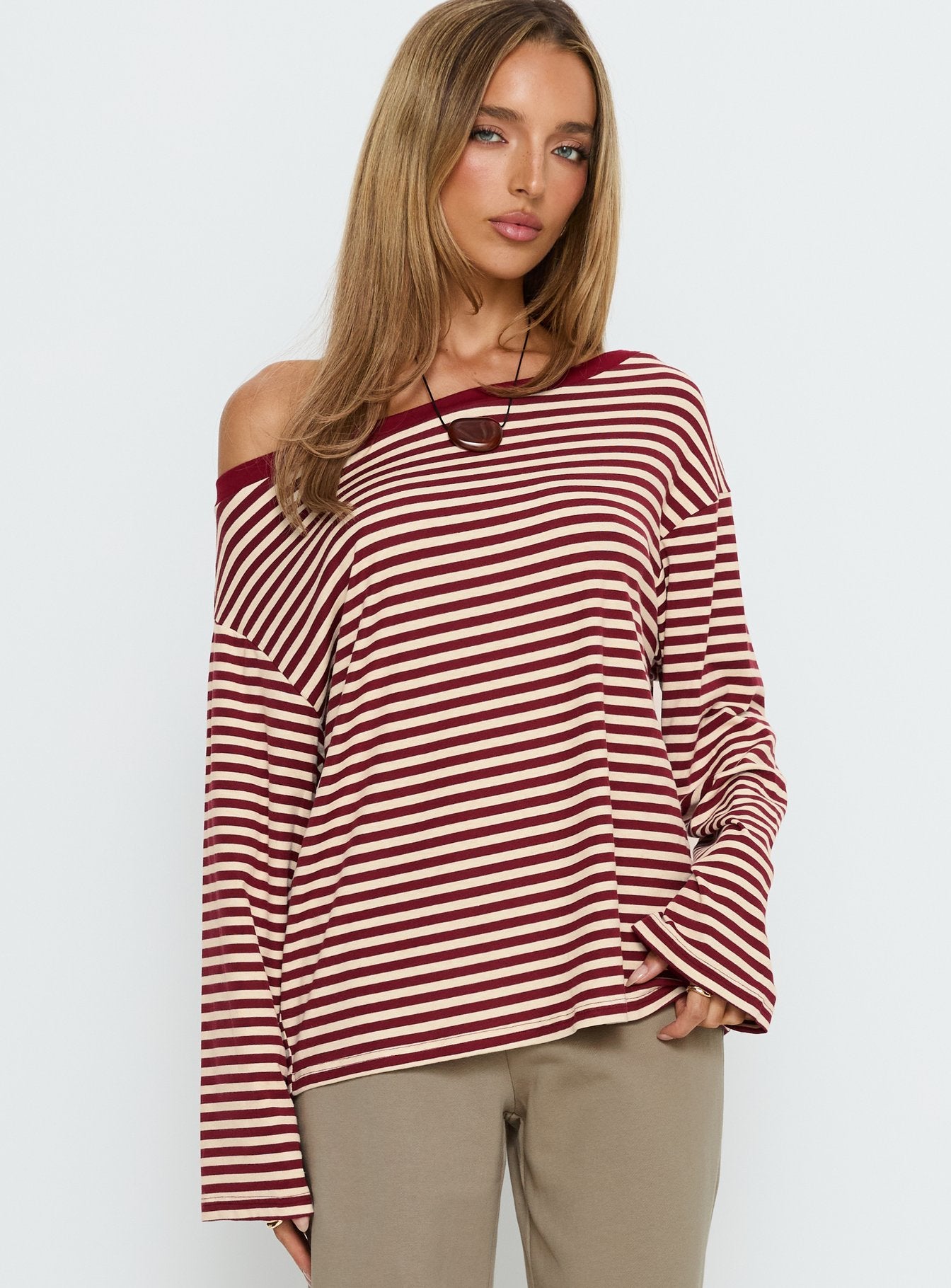 back view of model wearing Princess Polly Ralyssa Off Shoulder Long Sleeve Top Red Stripe Longline Jumpers 
