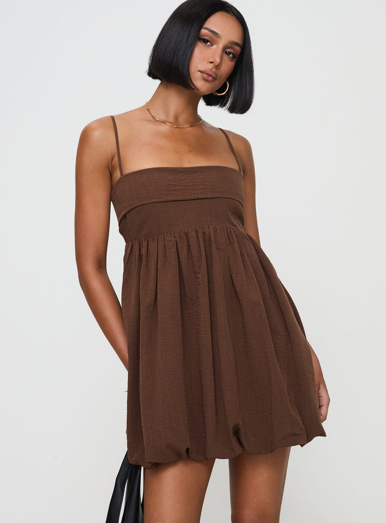 side view of model wearing Princess Polly Layken Bubble Hem Mini Dress Chocolate Tall Square Neck 