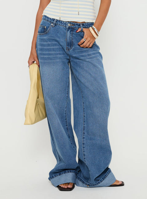 side view of model wearing Princess Polly Jacobie Mid Rise Wide Leg Jeans Mid Blue Wash Mid Rise Jeans 
