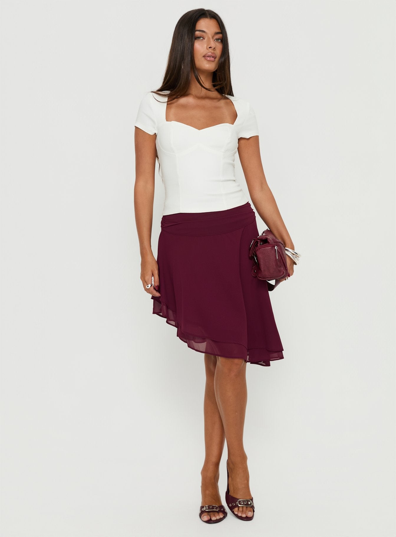   front view of model wearing Princess Polly Evanescence Asymmetrical Midi Skirt Cherry 
