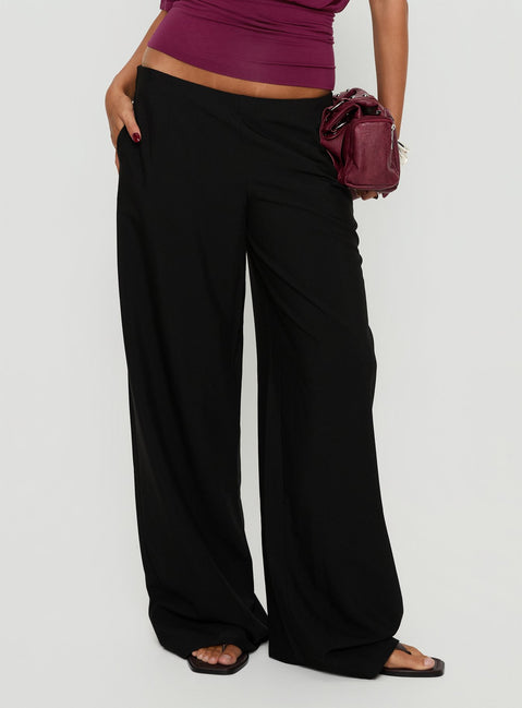 side view of model wearing Princess Polly Khane Low Rise Wide Leg Pant Black Low Rise Pants 