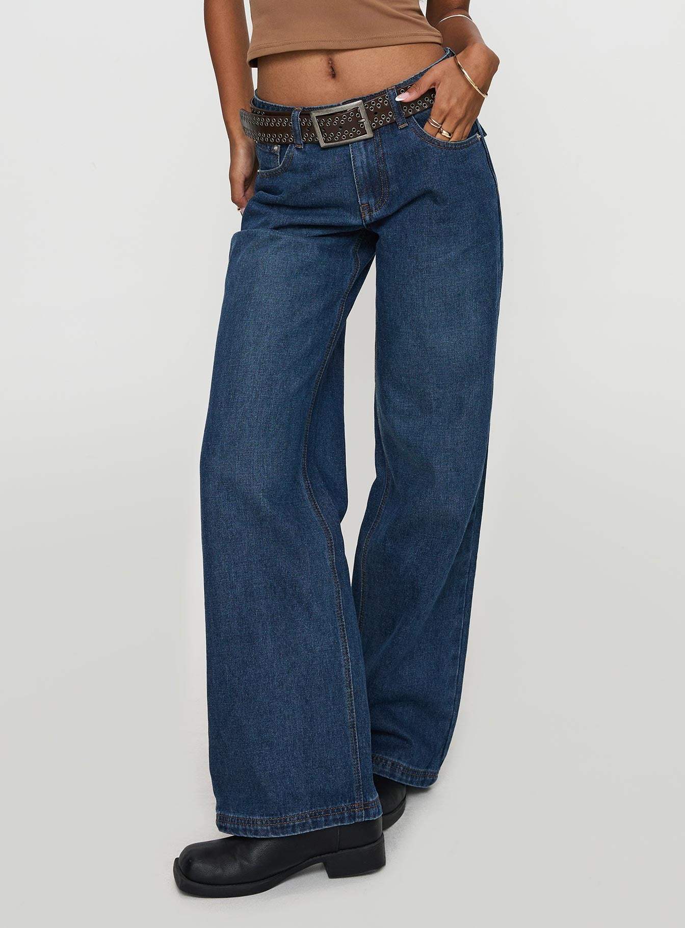 side view of model wearing Princess Polly Everlong Jean Dark Blue Wash Mid Rise 