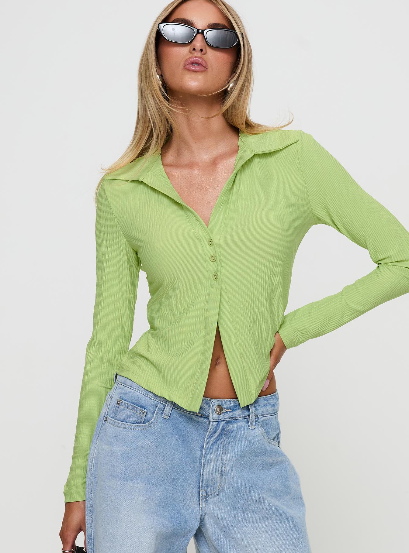front view of model wearing Princess Polly Echoes Long Sleeve Top Green Full Sleeves V-Neck 