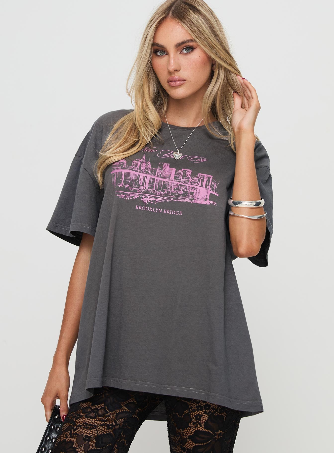 side view of model wearing Princess Polly Brooklyn Bridge Tee Black Half Sleeves Crew Neck 