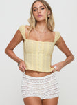 front view of model wearing Princess Polly Lyncher Top Yellow Short Sleeves Square Neck 