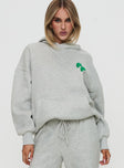 front view of model wearing Princess Polly Princess Polly Hooded Sweatshirt Bubble Text Grey Marle / Green 