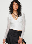 Top Long sleeve, floral lace material, sheer mesh sleeves, V-neckline  Good stretch, lined body 