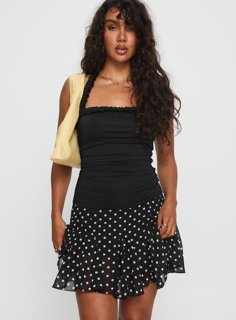   front view of model wearing Princess Polly Godet Mini Skirt Black / White Polka Mini Skirts 