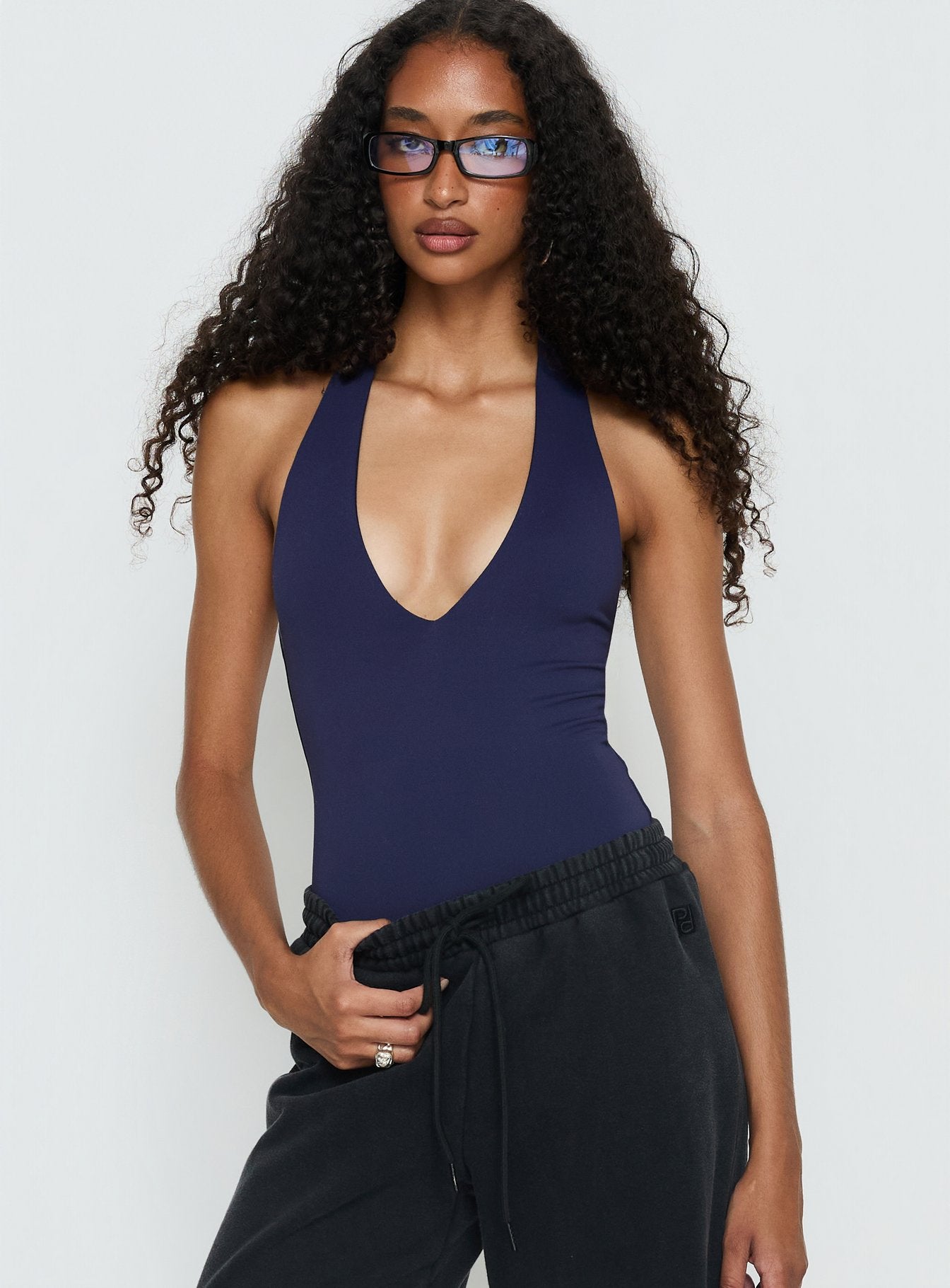front view of model wearing Princess Polly Someone New Halter Bodysuit Navy Sleeveless 