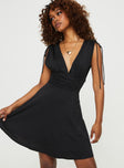 Front view of model wearing  front Princess Polly Asymmetric Neckline  Waltz Mini Dress Black