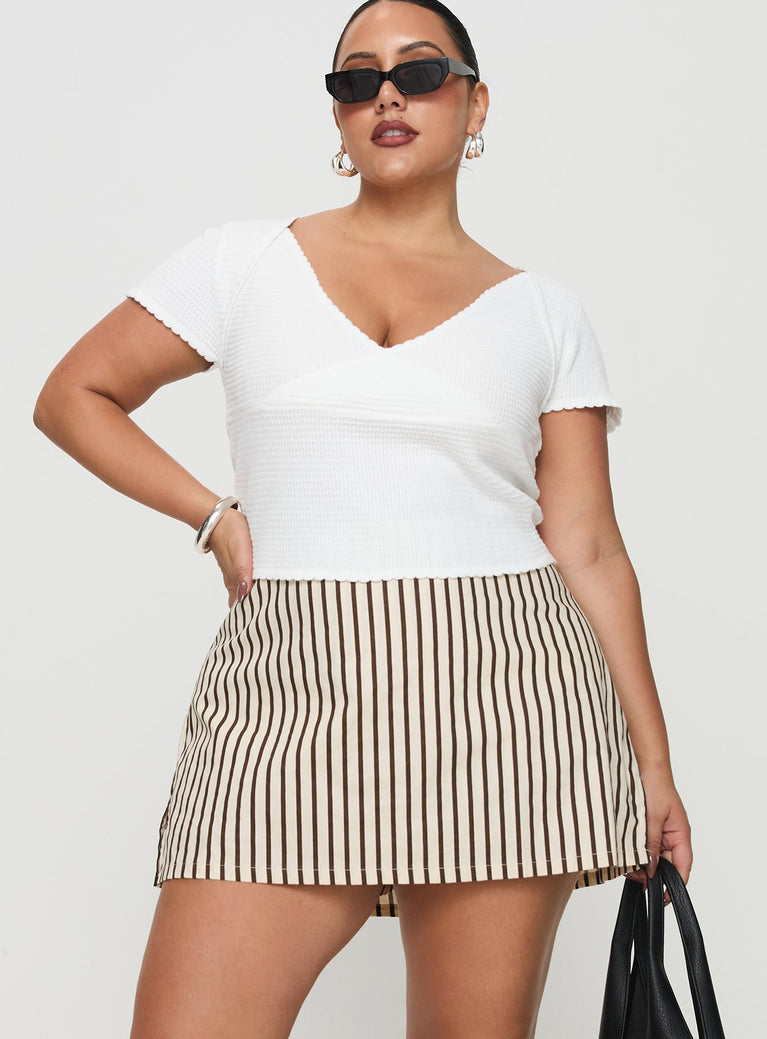 front view of model wearing Princess Polly Gigi Skort Beige Stripe Curve High Waisted Shorts 