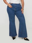 front view of model wearing Princess Polly Lucille High Rise Flare Leg Jeans Mid Wash Curve High Waisted 