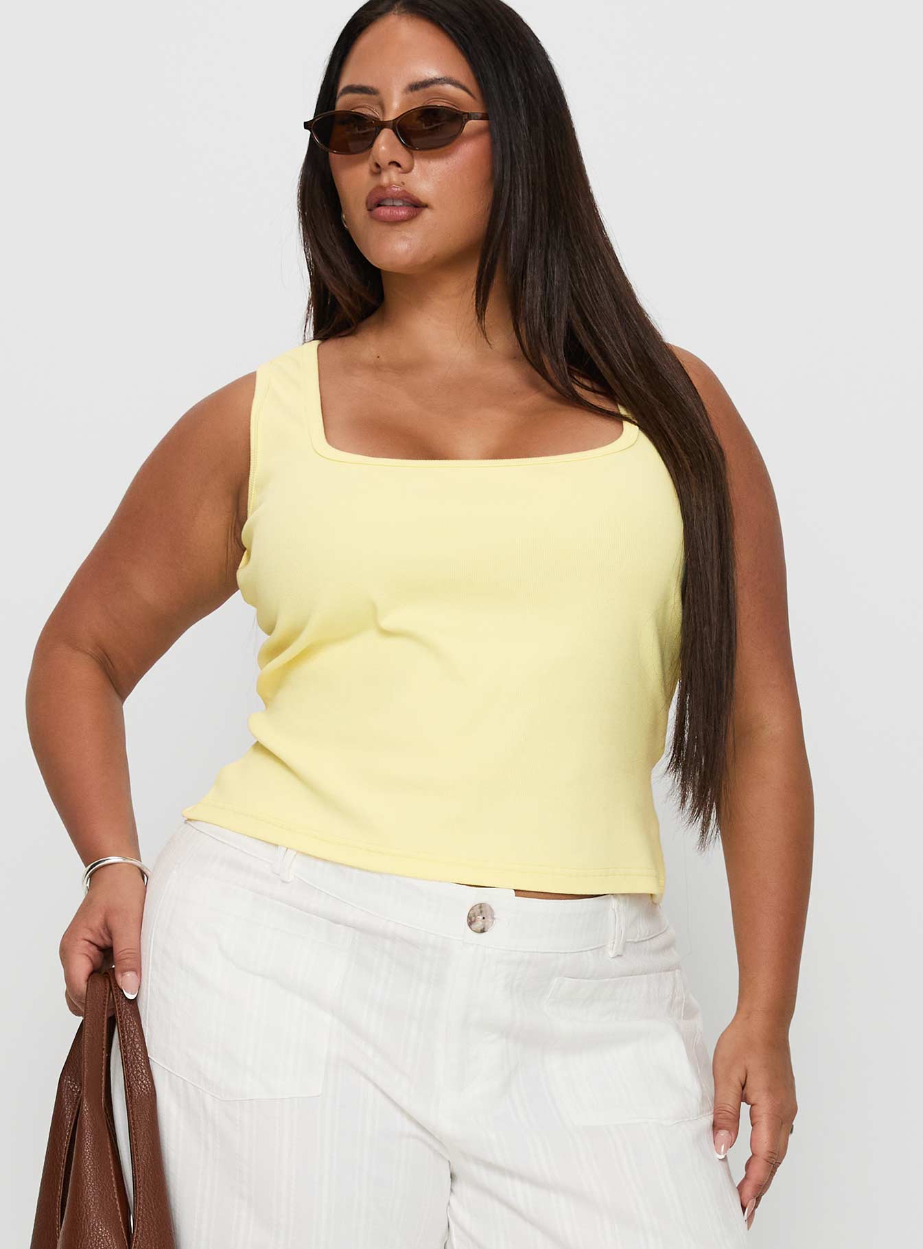 front view of model wearing Princess Polly Baseline Square Neck Rib Tank Top Lemon Curve Sleeveless Square Neck 