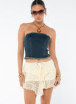 Mini skirt Lace material Tie up fastening along waist Layered lace details Good stretch Lined 