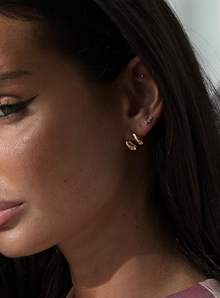 Gold-toned earrings Stud fastening, lightweight