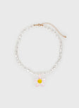 Gold-toned necklace Pearl detail, lobster clasp fastening, flower pendant