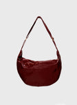 Red Faux leather shoulder bag Adjustable shoulder strap, gold toned hardware, zip fastening