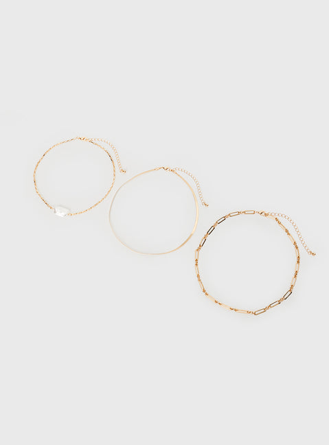 Gold-toned necklace Pack of three seperate chains, lobster clasp fastening, pearl detail