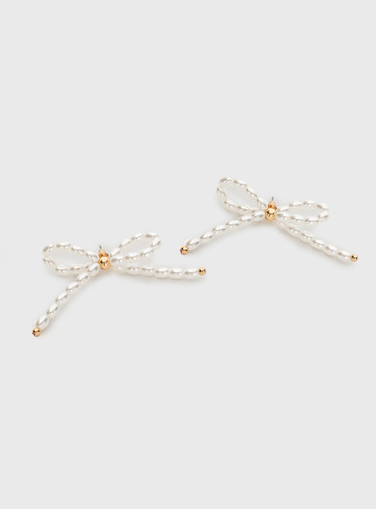 Earrings  Pearl bow design, gold-tone hardware, stud fastening