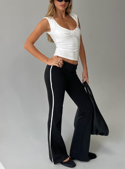 front view of model wearing Princess Polly Simki Jersey Flare Pants Black Low Rise Pants 