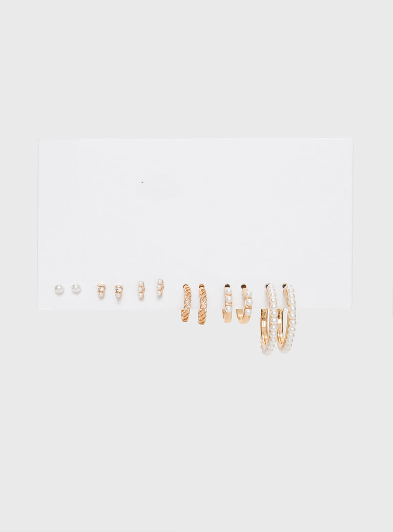 Earring Pack Six pairs of earrings in back, gold-toned, pearl details, each one unique Stud fastening