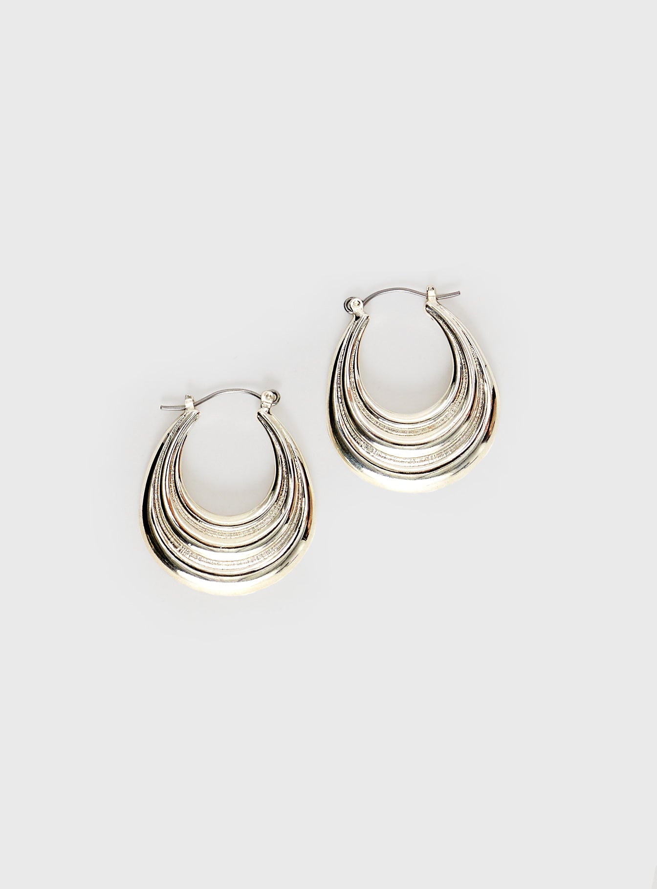 Gold-toned hoop earrings, clasp fastening
