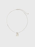 Necklace  Silver-toned dainty chain, drop charm  Lobster clasp fastening, adjustable length 