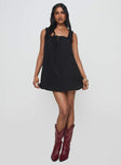 side view of model wearing Princess Polly Swing Mini Dress Black Petite Square Neck 