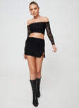 Low rise mini skirt, ruched waistband, slit at side Good stretch, unlined 