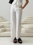 side view of model wearing Princess Polly Sofi Pants Natural Petite High Waisted Pants 