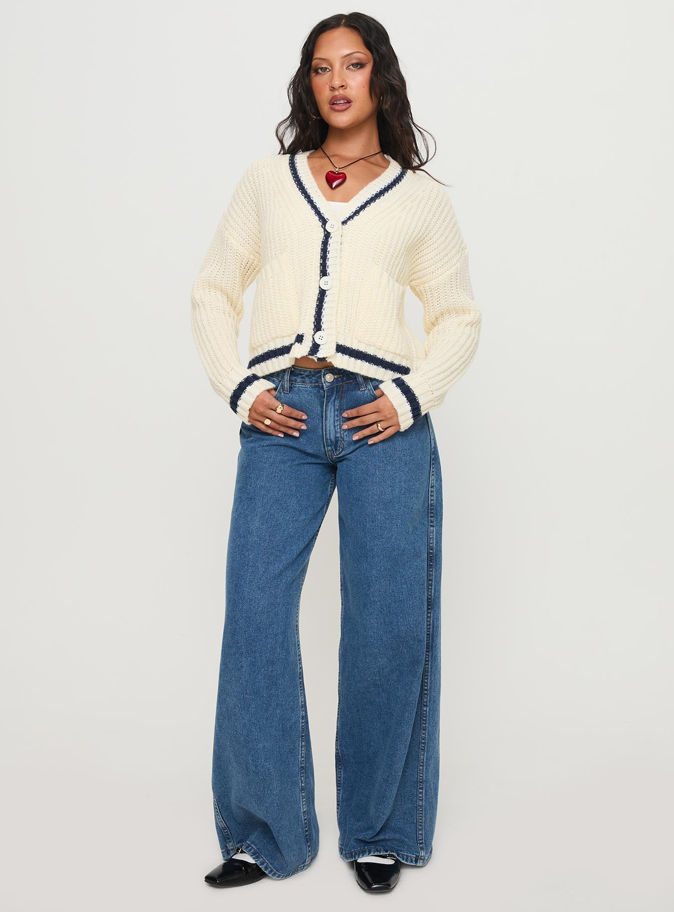 side view of model wearing Princess Polly Tavian Knit Cardigan Navy / Cream 