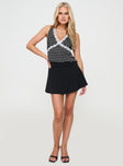 front view of model wearing Princess Polly Wondering Top Black Polka Dot Sleeveless V-Neck 