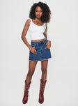 Front view of model wearing  front Crystal Bay Skort Mid Wash Princess Polly High Waisted Shorts 