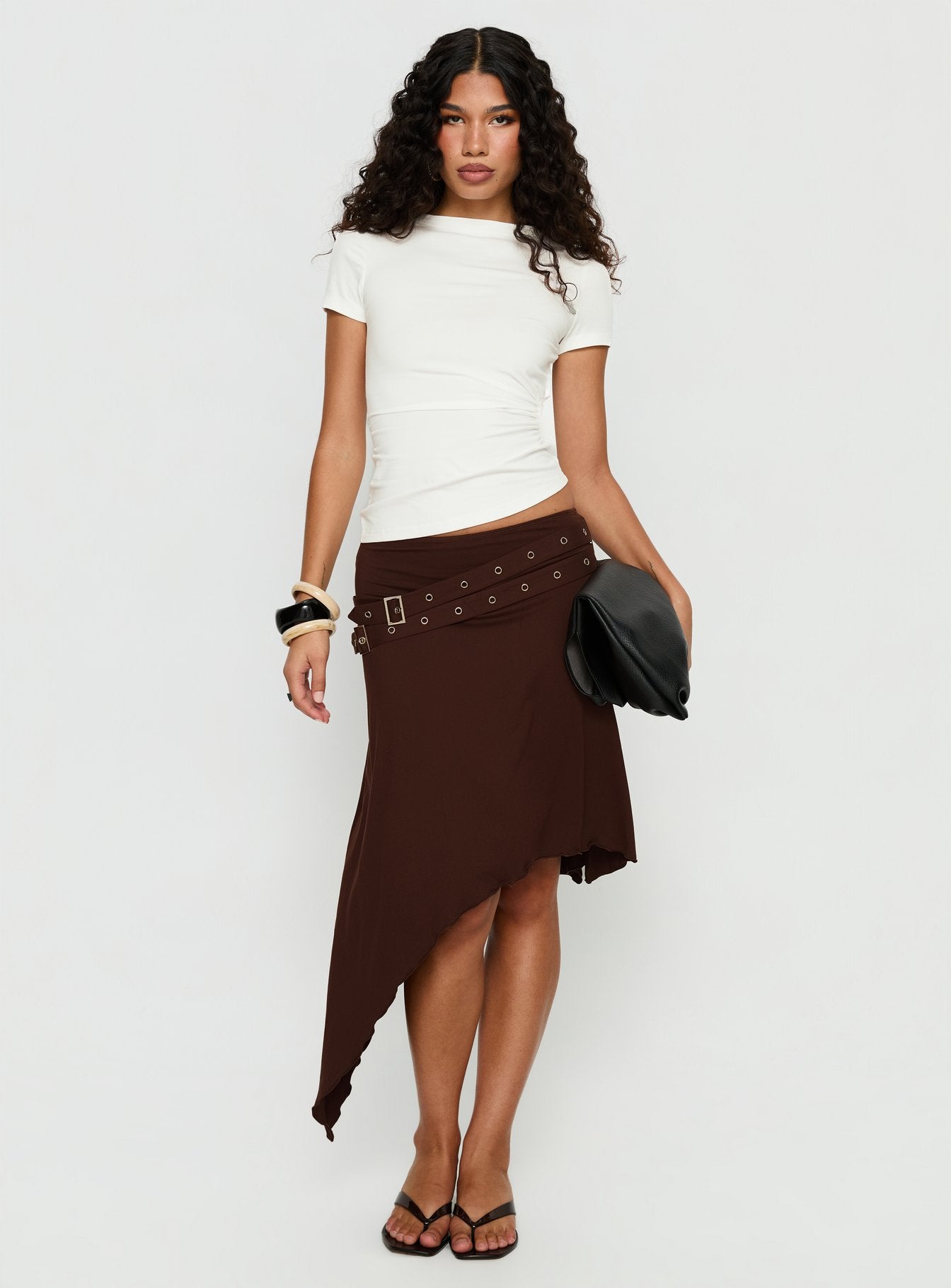 back view of model wearing Princess Polly Lorensa Double Buckle Asymmetrical Midi Skirt Brown Midi Skirts 