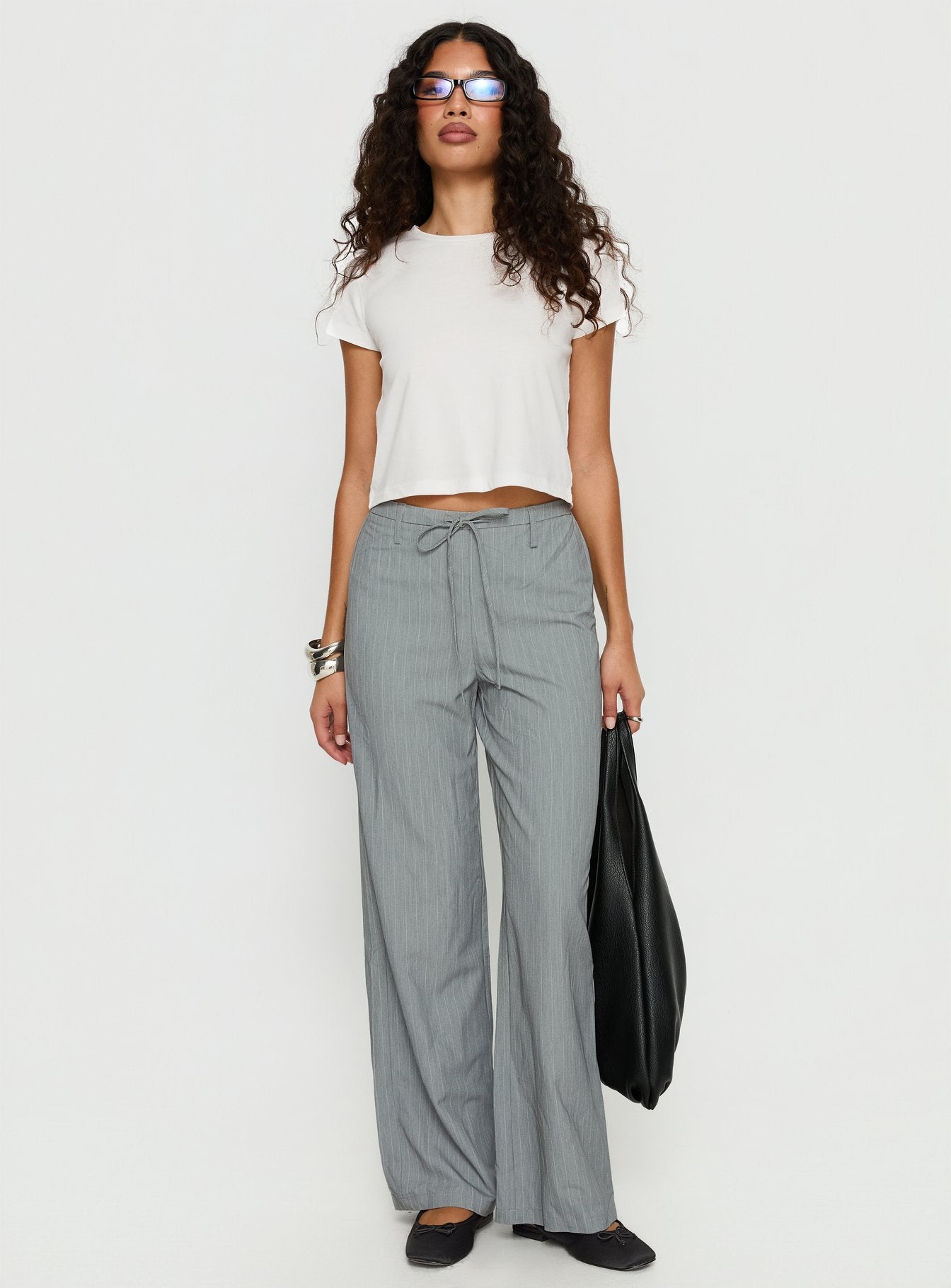 side view of model wearing Princess Polly Idolised Tie Waist Pant Grey Pinstripe Mid Rise Pants 