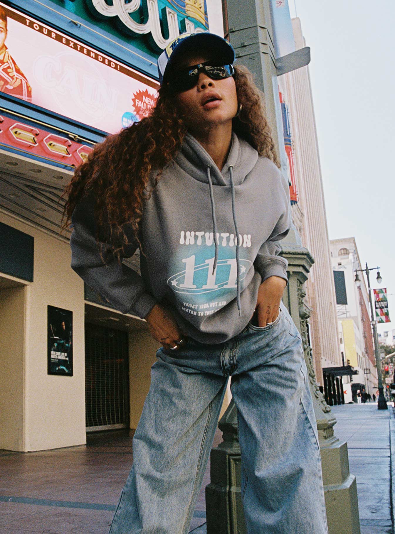 side view of model wearing Princess Polly Intuition Hooded Sweatshirt Bubble Text Charcoal regular 