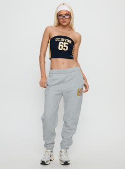side view of model wearing Princess Polly UC Irvine Basic Sweatpants Grey Mid Rise Pants 