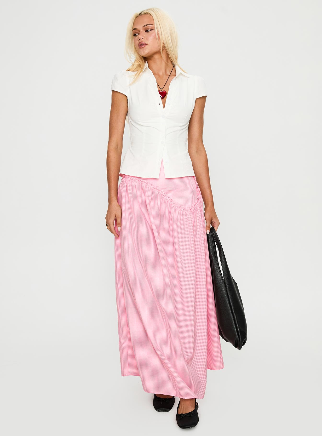   side view of model wearing Princess Polly Apresia Maxi Skirt Pink Gingham Maxi 