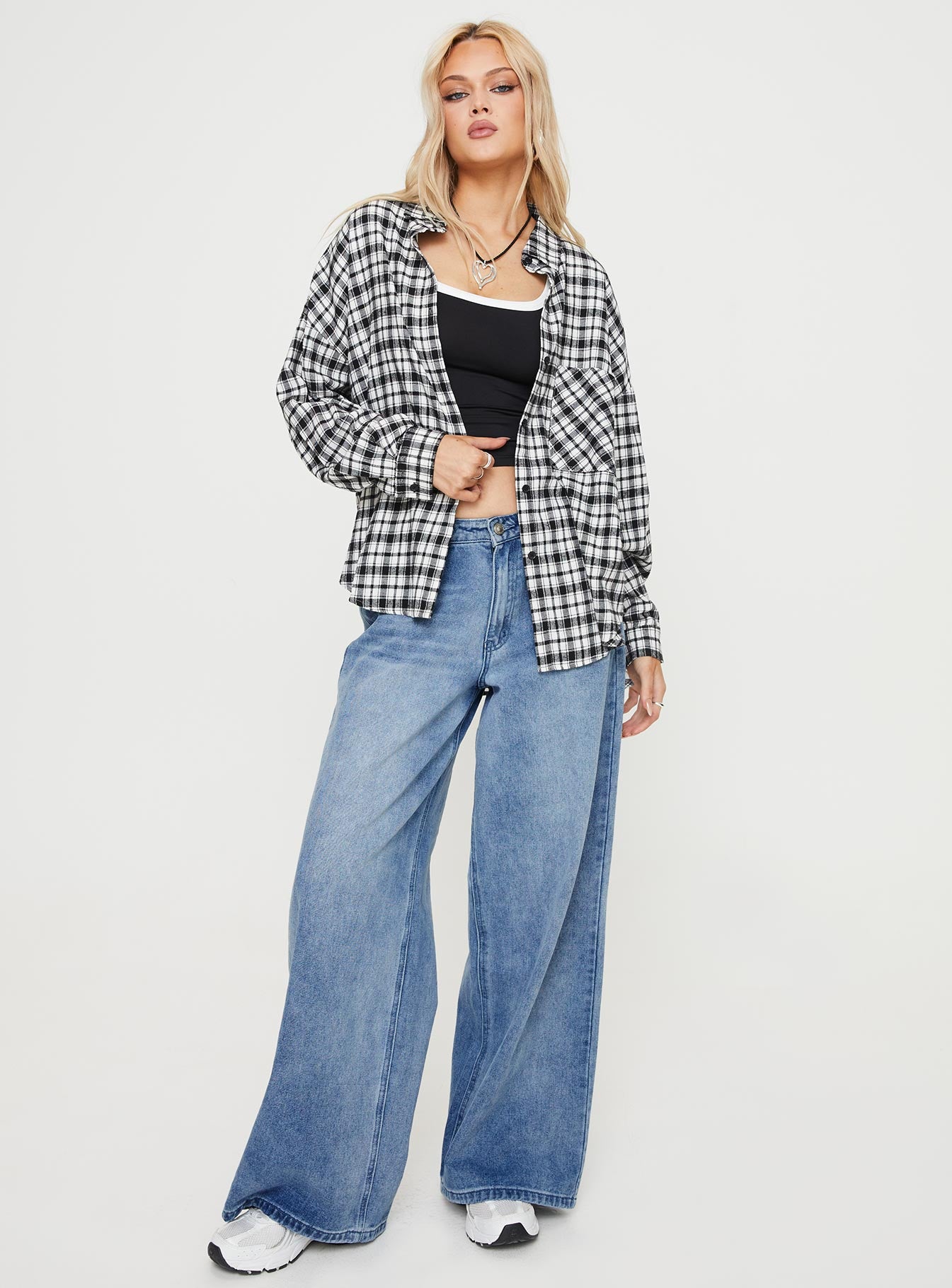 Front view of model wearing  front Princess Polly Full Sleeves Crew Neck  Medley Shirt Black / White Check