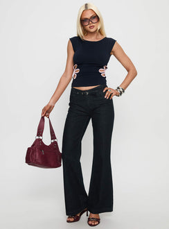 front view of model wearing Princess Polly Slow Ride Mid Rise Bootleg Belted Jeans Dark Indigo Blue Mid Rise Jeans 