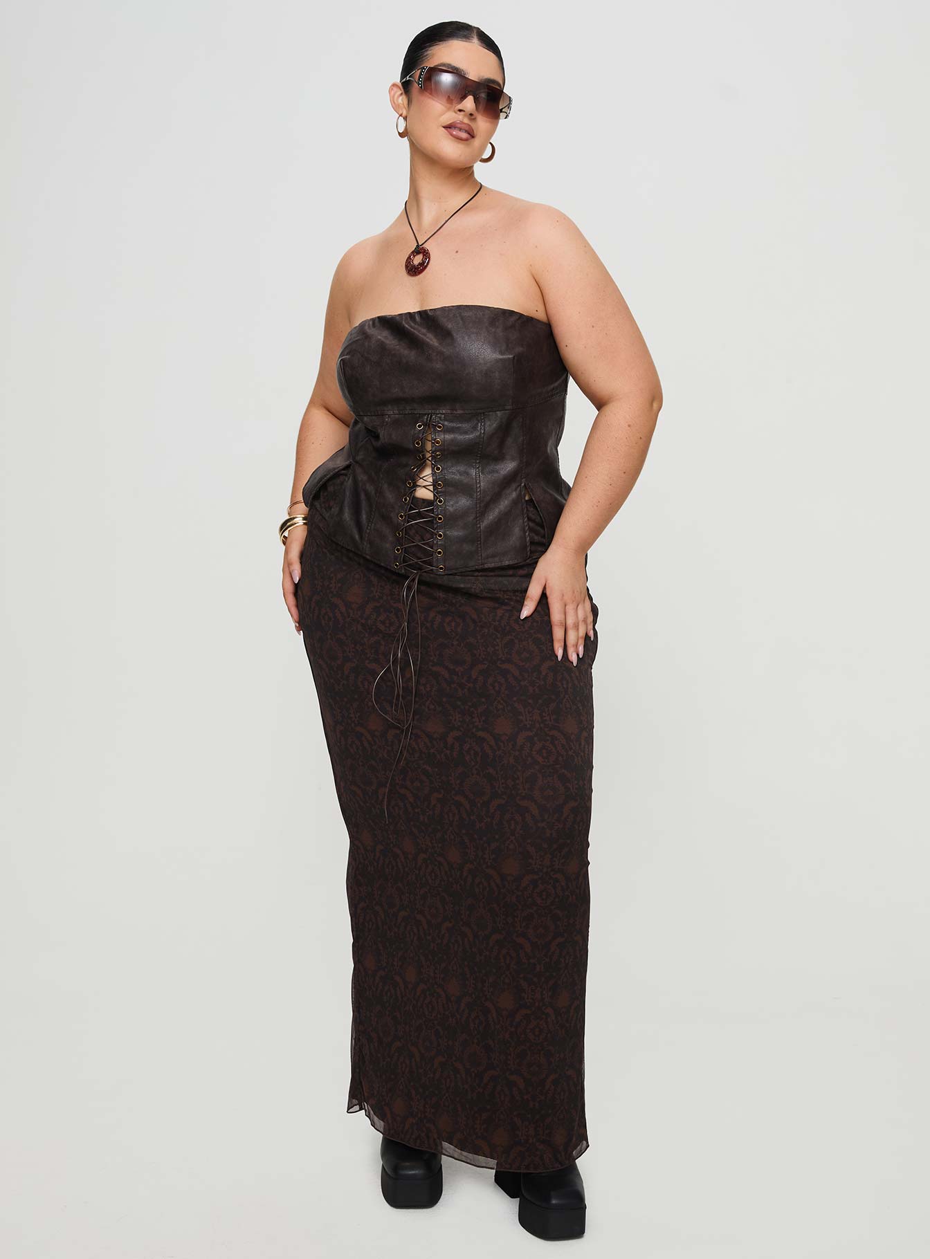 front view of model wearing Princess Polly Afraid Strapless Faux Leather Top Brown Curve Sleeveless straight 