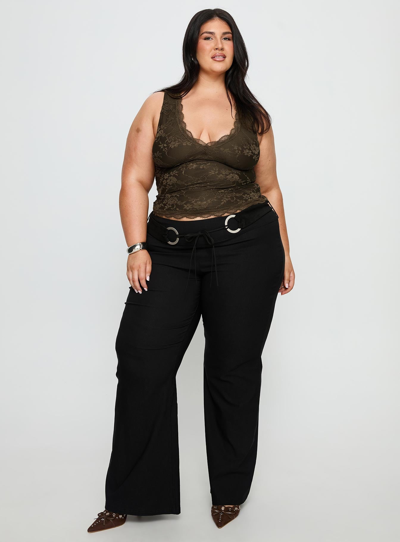 front view of model wearing Princess Polly Twinflame Low Rise Hardware Pants Black Curve Mid Rise Pants 