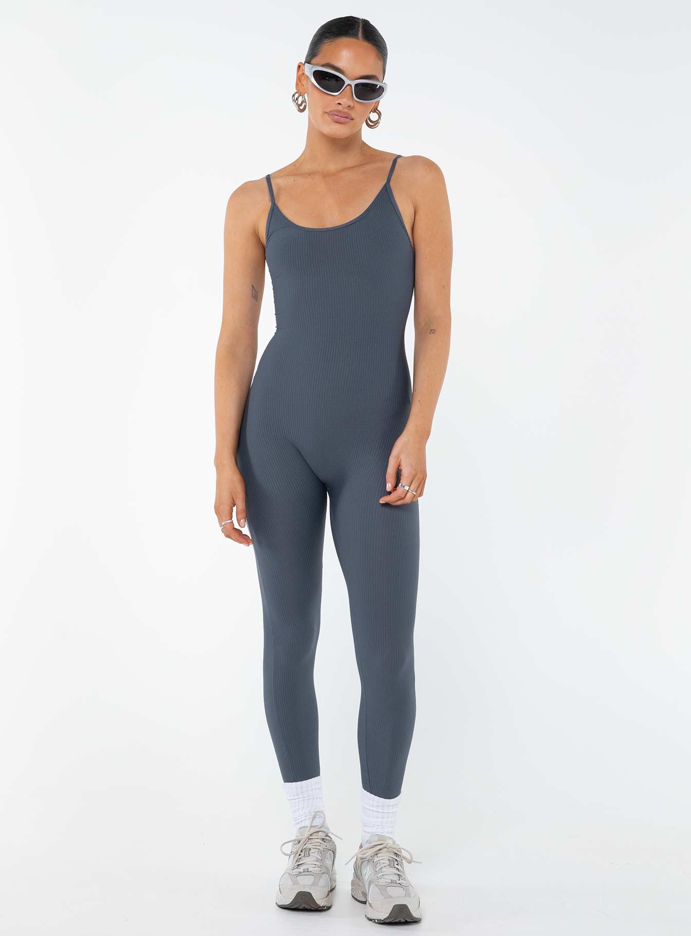 Jumpsuit Ribbed material Scooped neckline Adjustable shoulder straps Good stretch Unlined 