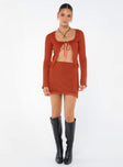 Long sleeve knit top, open front Scooped neckline, tie fastening at bust, flared cuff