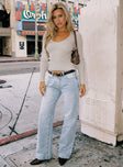 side view of model wearing Princess Polly Copperfield Baggy Denim Jeans Light Blue Wash High Waisted 