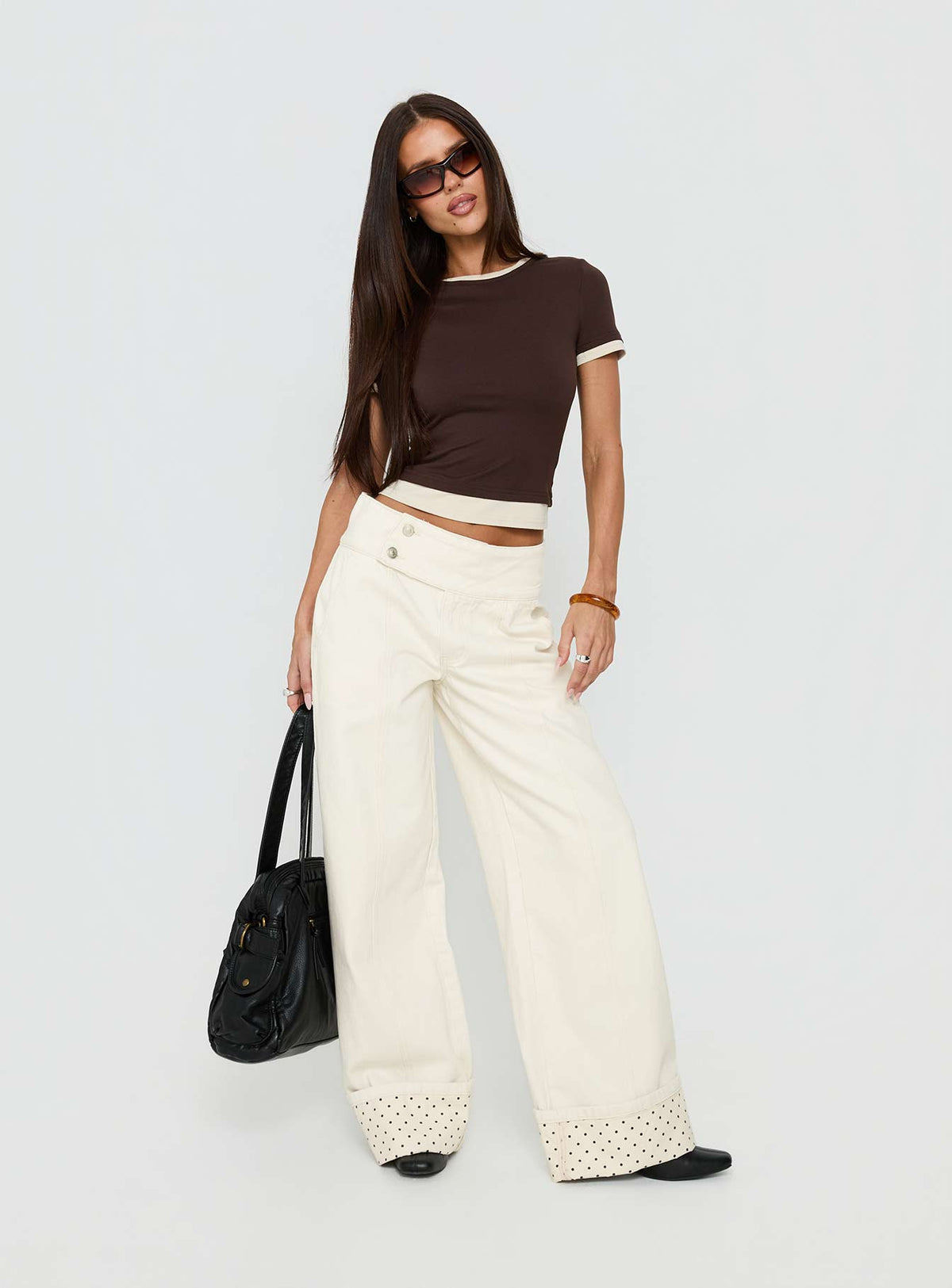 Featuring the Nikoletta Foldover Jeans Cream / Polka Petite womens-jeans in high-rise front view of model wearing Princess Polly